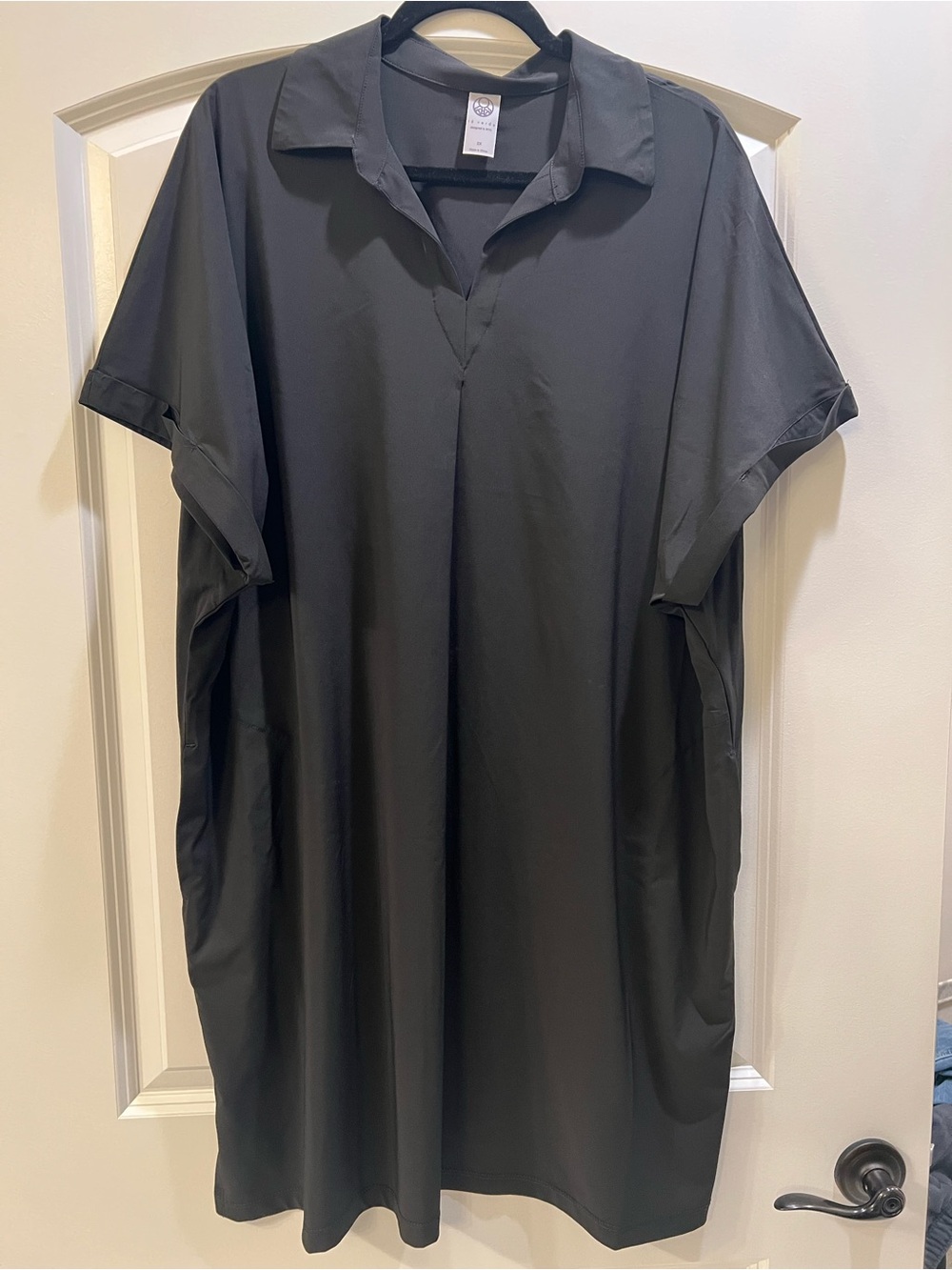 Black relaxed dress.  Hits right above knee.  With pockets